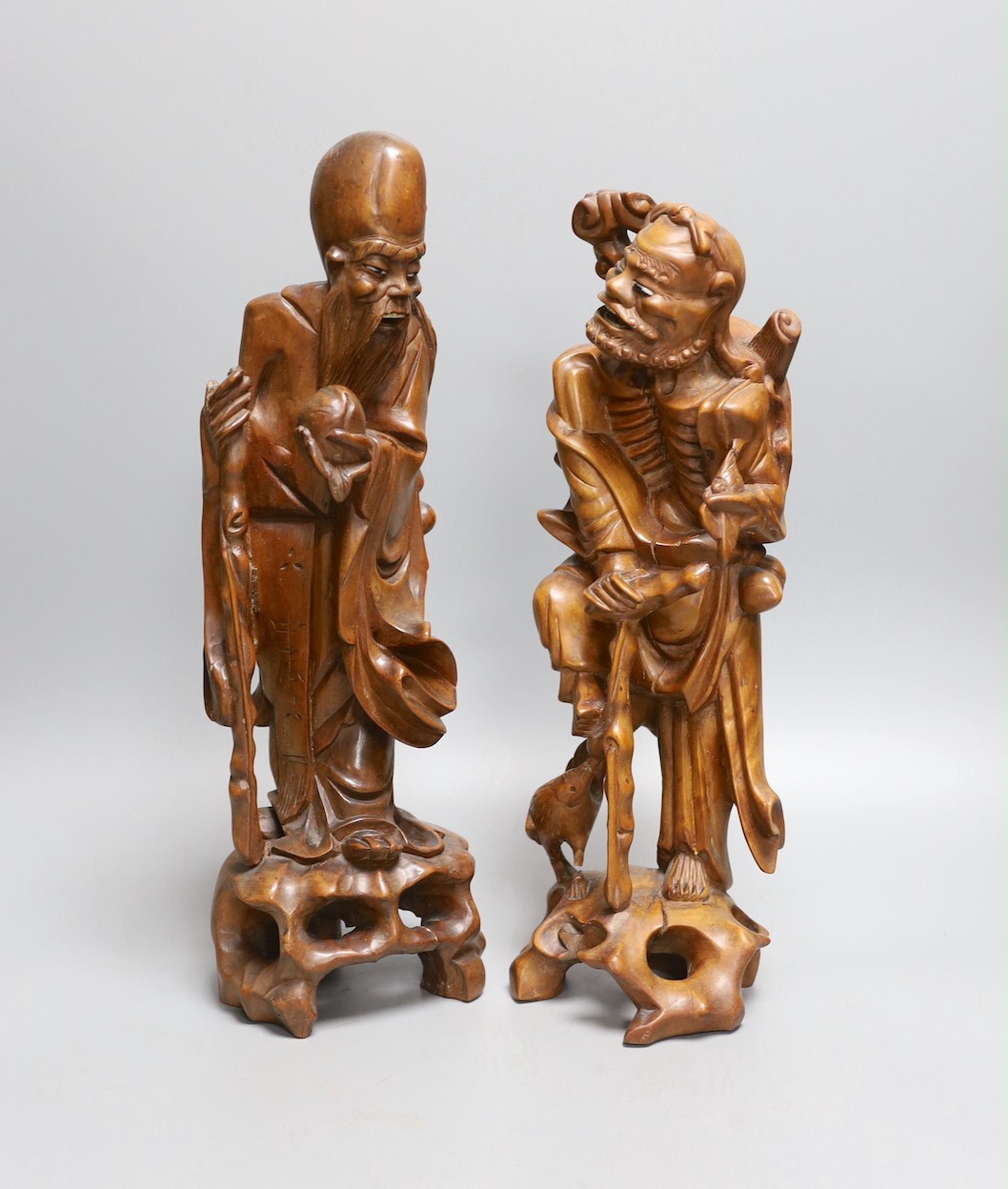 Two 19th century Chinese carved rootwood models of sages, 36cm